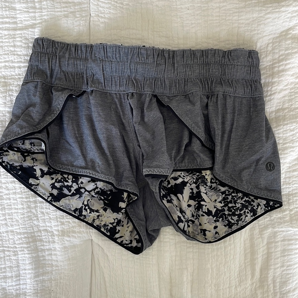 Short mid rise lululemon reversible shorts. Gray on one side and floral on other